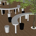 Outdoor Rest Area With Wooden Deck Curved Benches And Green Trees