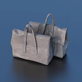 Two Gray Minimalist Handbags With Leather Handles And Sleek Design On Blue Background