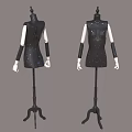 Two Black Mannequins Wearing Sequined Dresses With White Arms On Stands