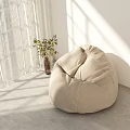 Beige Bean Bag Chair In Bright Room With Sunlight White Curtains And Green Plant