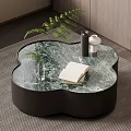 Elegant Modern Clover Shaped Coffee Table With Marble Top Book Vase And Green Plant