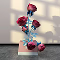 Stylish Floral Arrangement with Red Roses Blue Stems Leaves in Pink White Vase Light Wall