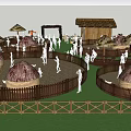 Outdoor Rustic Activity Area With Thatched Huts Wooden Fences And People