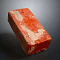 Close Up View Of Red Construction Brick With White Patches And Rough Surface Texture