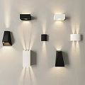 Modern Black and White Minimalist Wall Sconces on Light Colored Wall with Illumination Effects