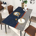 Dining Table Set With Blue Houndstooth Tablecloth Golden Plates Wine Glass And Brown Chairs