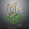 Classical Architectural Model Featuring White Columns Green Base And Decorative Tops With Small Stones