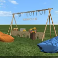Outdoor Grass Area With Sunday Wooden Swing Frame Orange Blue Bean Bags And Fruit Baskets