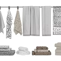 Neutral Colored Towels Hanging On Rail And Folded In Various Styles