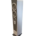 Stylish Living Room Setup With Floor Standing Speaker And Home Audio System