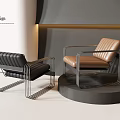 Modern Accent Chairs In Black And Brown With Metal Frames And Leather Seats On