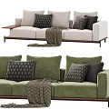 Beige and Green Three Seater Sofa with Decorative Pillows and Throw Blanket