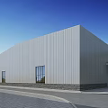 White Industrial Warehouse With Corrugated Metal Exterior Stone Base Windows Green Trees And Blue Sky