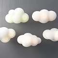 Cloud Shaped Chandeliers in White and Light Green Hanging on Gray Wall