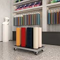 Colorful Fabric Rolls Display On Cart With Shelves In Showroom Interior