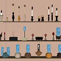 Colorful Candle and Candlestick Display with Various Designs on Three Tiered Shelves