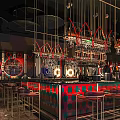 Modern Bar Interior With Neon Lights Colorful Counter High Stools And Decorative Shelves Wine Racks