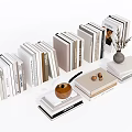 Stacked Books and Magazines With Decorative Vase Walnuts and Small Decor Items