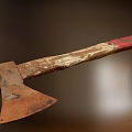 Old Rusted Axe With Worn Wooden Handle And Red Grip As Historical Weapon