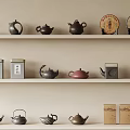 Display of Traditional Ceramic Wares with Colorful Teapots and Tea Caddies on Shelves
