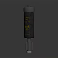 Black Cylindrical Weapon with Yellow Radioactive Symbol and Caution Label on Metal Base