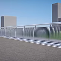 Modern Metal Railings Along Urban Road With Green Grass And Buildings