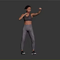 Woman Practicing Boxing Stance In Gray Sports Bra And Leggings
