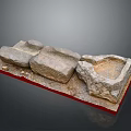 Handmade Wood and Stone Craft Pieces with Rough Surfaces on Red Display Base