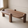 Modern Walnut Coffee Table Featuring Oval Top Cylindrical Legs And Round Decorative Knobs