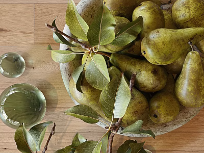 Fresh Ripe Green Pears With Leaves And Branches In Bowl On Wooden Table 3d model