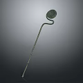 Woman Adorning Traditional Ancient Bronze Hairpin With Circular Decorative Top