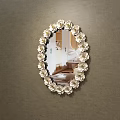 Oval Mirror With Floral Accents Reflecting Room Interior With Sofa And Carpet Against Brown Wall