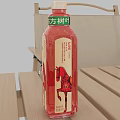 Square Bottle Leaf Black Tea in Red Bottle with Horse Design on Outdoor Wooden Table