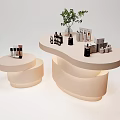 Large Irregular Shaped And Small Round White Display Shelves With Bottles Jars And Green Plant