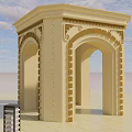 Beige Arched Entrance Gate With Intricate Carvings Set In Open Space Under Blue Sky
