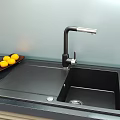 Black Single Bowl Kitchen Sink With Modern Faucet And Integrated Countertop