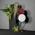 Floral Installation Featuring Black Pillar Greenery Red Blooms Hanging Vines And Red White Textured Circles