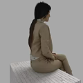 Woman Wearing Beige Suit and Light Shirt Sitting on White Brick Platform with Gray Background