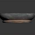 Hand Carved Black Clay Basin With Cracked Surface And Orange Rim