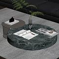 Round Green Marble Coffee Table With Books Vase Green Plant And Glasses On Gray Rug