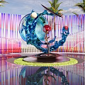 Sculpture With Blue Structure Human Figure Red White Spheres Purple Pink Striped Background Palm Trees
