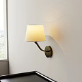 Modern Wall Lamp With White Fabric Shade And Metal Base Mounted On White Wall