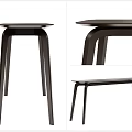 Modern Sleek Dark Colored Dining Table With Curved Legs And Minimalist Design