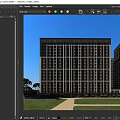 Modern High Rise Residential Building With Exterior Windows Surrounding Trees And Clear Sky