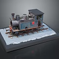 Old Steam Train Model in Blue and Black on Snow Covered Platform with Gray Background