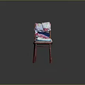 Colorful Stacked Clothes on Red Wooden Chair with T-shirts and Towels against Dark Background