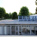 Modern Building Exterior With Large Glass Doors Wooden Deck And Green Trees Under Blue Sky