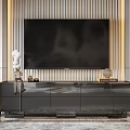 Elegant Modern Black TV Stand With Gold Accents Drawers And Decorative Sculptures On Striped Wall