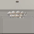 Modern White Chandelier With Petal Shaped Design Hanging From Ceiling In Minimalist Interior