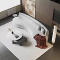 Gray Curved Sectional Sofa With Brown Blanket And Round Coffee Table On Area Rug